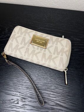 Michael Kors Cream Beige Logo Wristlet with Gold Plate